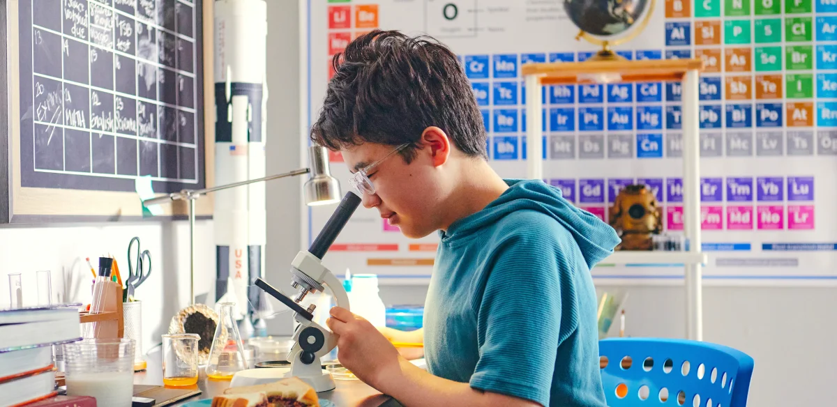 Student with a microscope